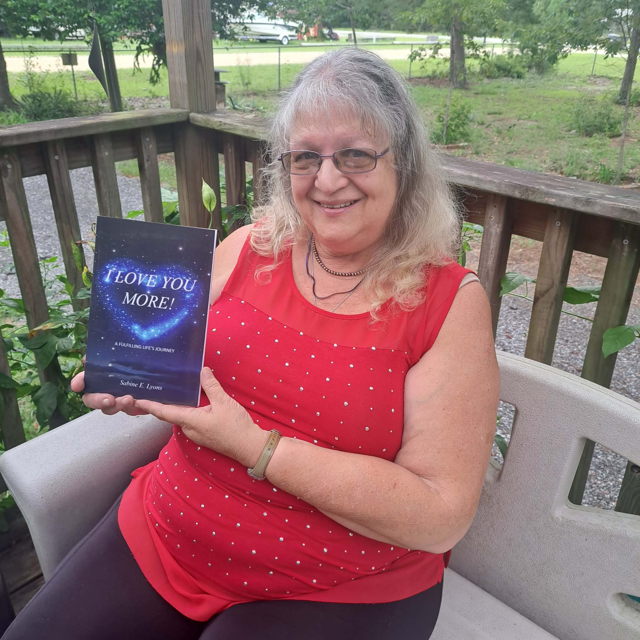 Sabine Lyons with her book "I Love You More"